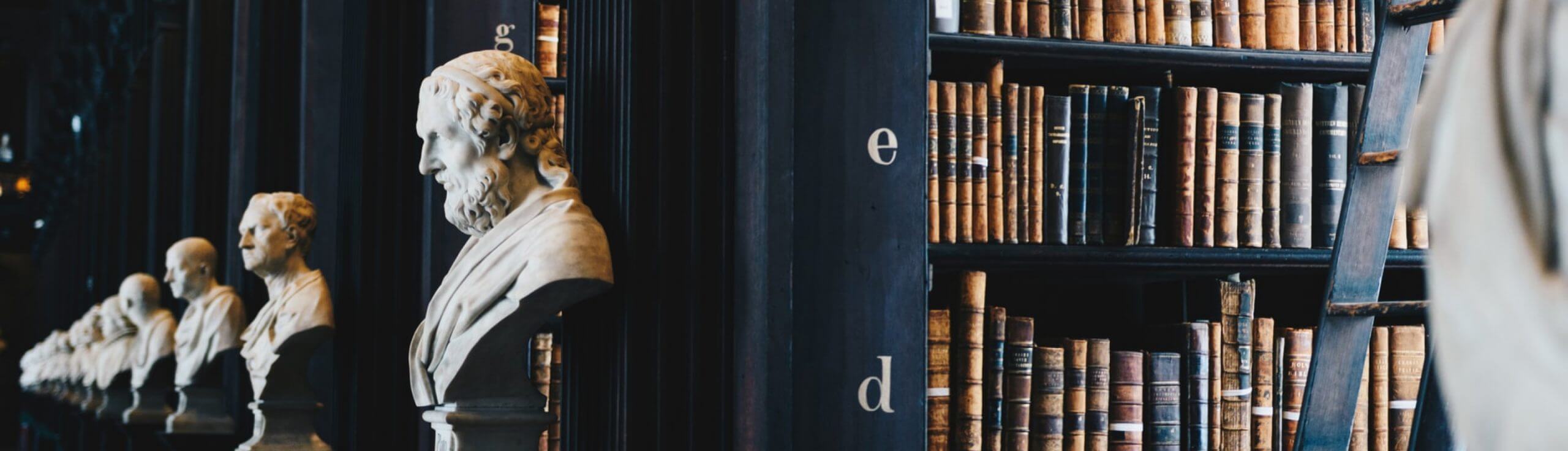 Study and writing desk with open books—philosophy and process at Decision Analysis